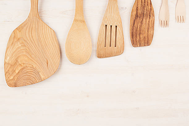 istock Design concept  mockup  empty wood beige spoons white wood background. 625452562