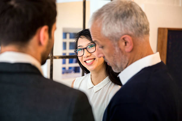 istock Female professional discussing with businessmen 625456432