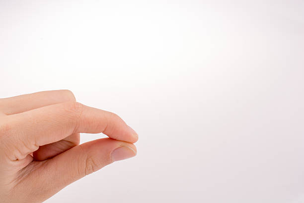 istock Piece of black paper in hand 625457782