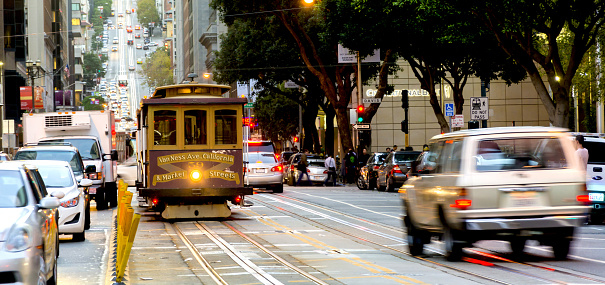 San Francisco, CA, USA - October 22, 2016: San Francisco, CA, USA, october 22, 2016; traditional Cable car in the traffic of San Francisco