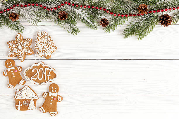 istock Christmas gingerbread, spruce branches on wooden background top view 625459942