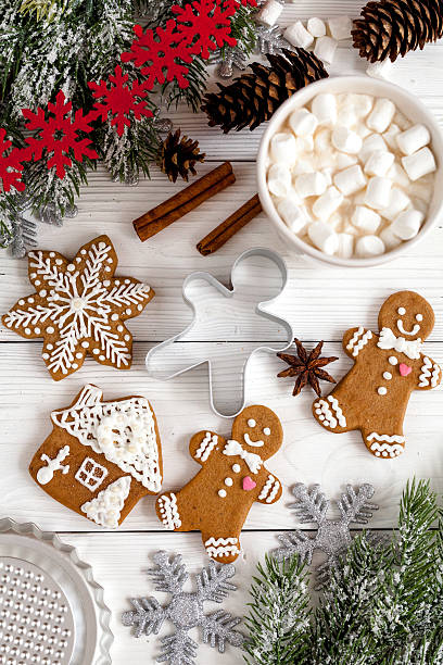 istock Christmas gingerbread, spruce branches on wooden background top view 625460662