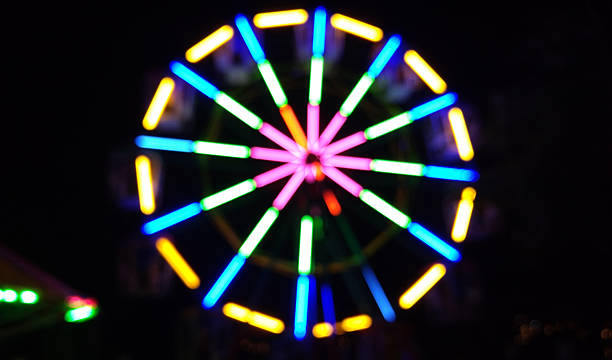 istock Colorful light on ferris wheel at night (abstract Blur style) 625466246