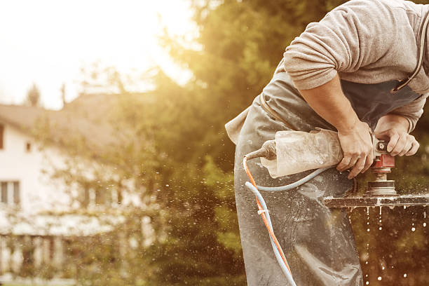 istock handyman working with grinding machine on a stone plate 625467010