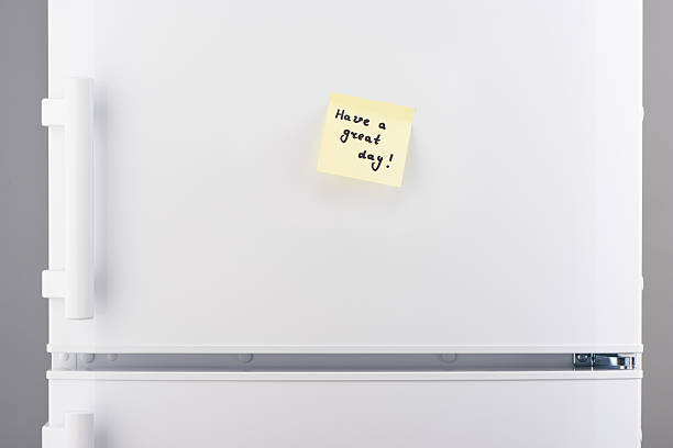 istock Have a great day note on light yellow sticky paper 625467590