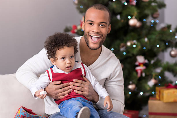 istock Happy bearded man holding his son 625468130