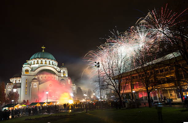 New Year's fireworks New Year's Eve celebration whit fireworks over the Church of Saint Sava. long exposure winter crowd blurred motion stock pictures, royalty-free photos & images