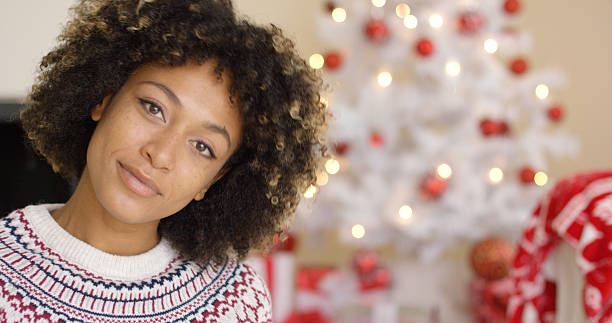 istock Close up on grinning woman near Christmas tree 625471880