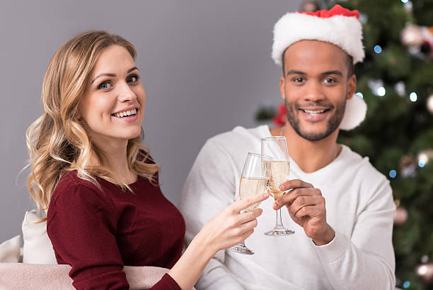 istock Cheerful good looking couple drinking champagne 625473324