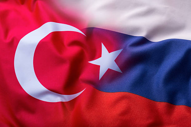 Turkey and Russia flag. World flag money concept stock photo