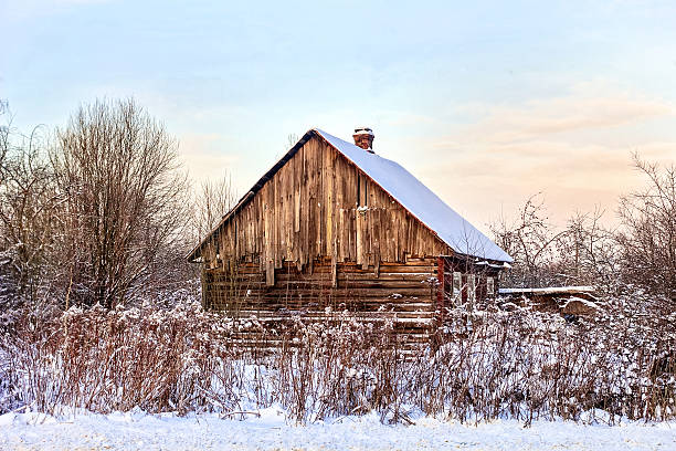 istock Abandoned wooden house in snow 625490202