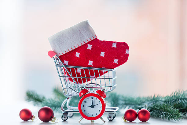 istock Alarm clock and christmas sock 625490284