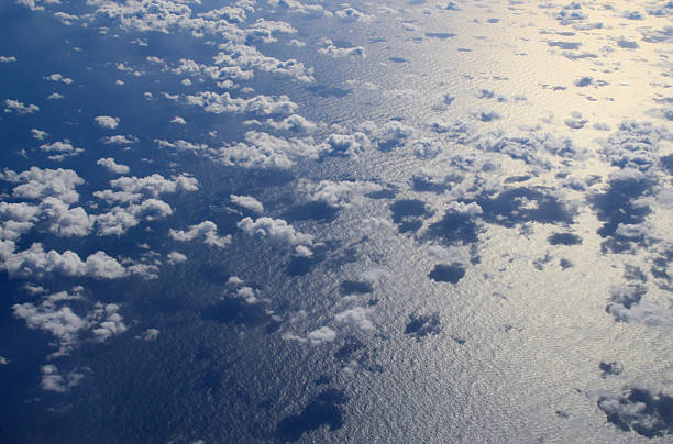istock Clouds and ocean seen from airplne 625491780