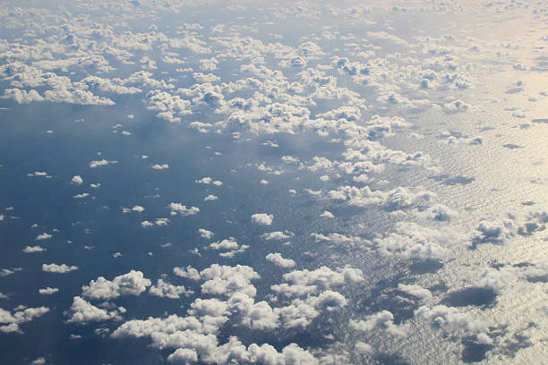 istock Clouds and ocean seen from airplne 625491884