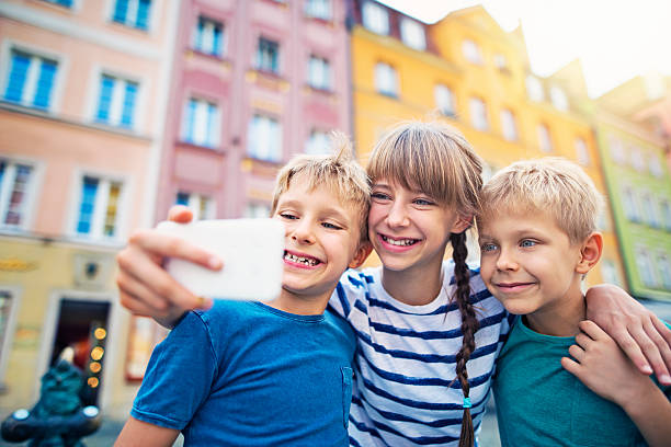 istock Brothers and sister tourists taking selfie 625492064