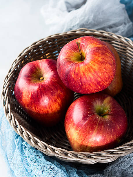 istock Fresh apples in basket. Top view. Closeup vertical 625492134