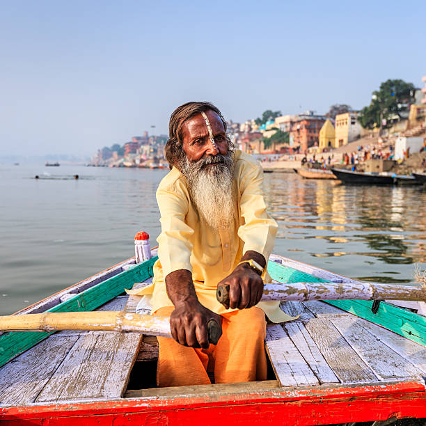 istock Sadhu rowing boat on the holy Ganges River in Varanasi 625492468