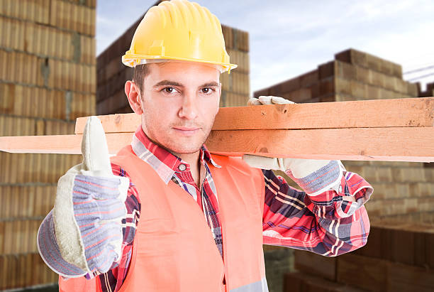 istock Portrait of young builder showing thumb up sign 625493592