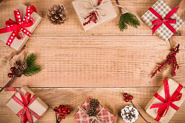 istock Various Christmas gift boxes and decoration on wooden planks background 625493696