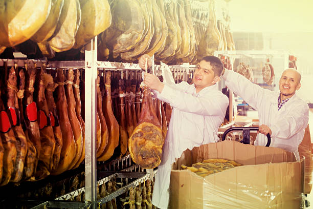 istock Farm workers checking condition of jamon 625499448