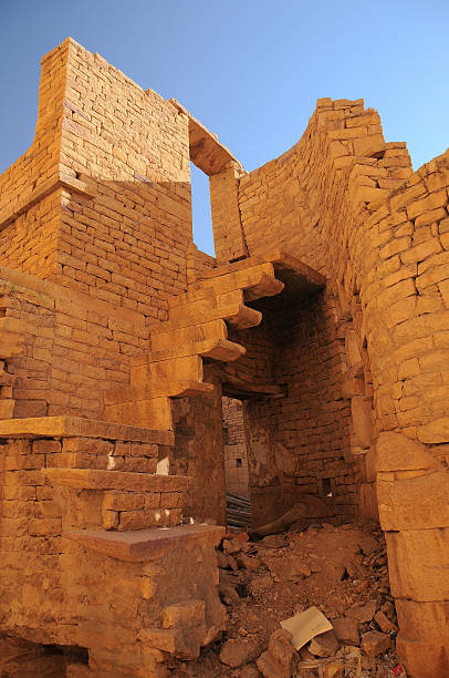 Young woman walking in ruins. Destroyed places.