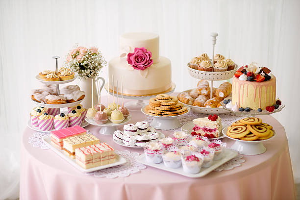 istock Table with loads of cakes, cupcakes, cookies and cakepops. 625502388