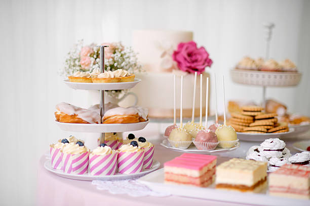 istock Table with loads of cakes, cupcakes, cookies and cakepops. 625502758