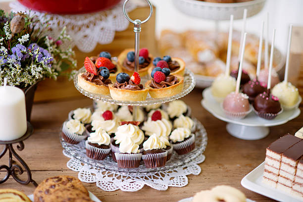 istock Table with various cookies, tarts, cakes, cupcakes and cakepops 625503246
