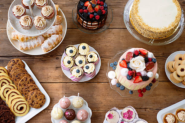 istock Table with cakes, cookies, cupcakes, tarts and cakepops. 625504132