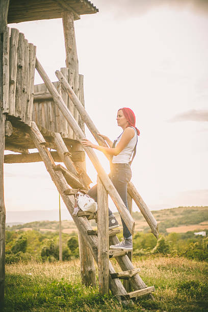 istock Girl climbs on old  stairs 625505482