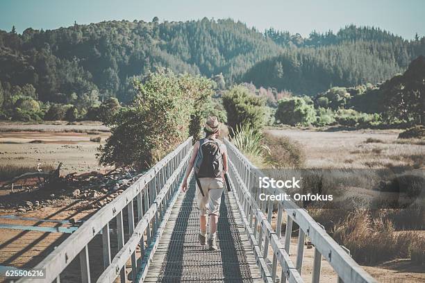 Woman Walking Abel Tasman Coast Track New Zealand South Island Stock Photo - Download Image Now