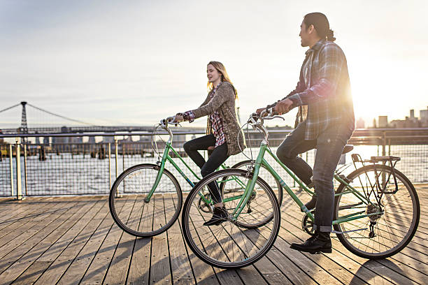 istock Couple enjoying cycling on promenade 625510244