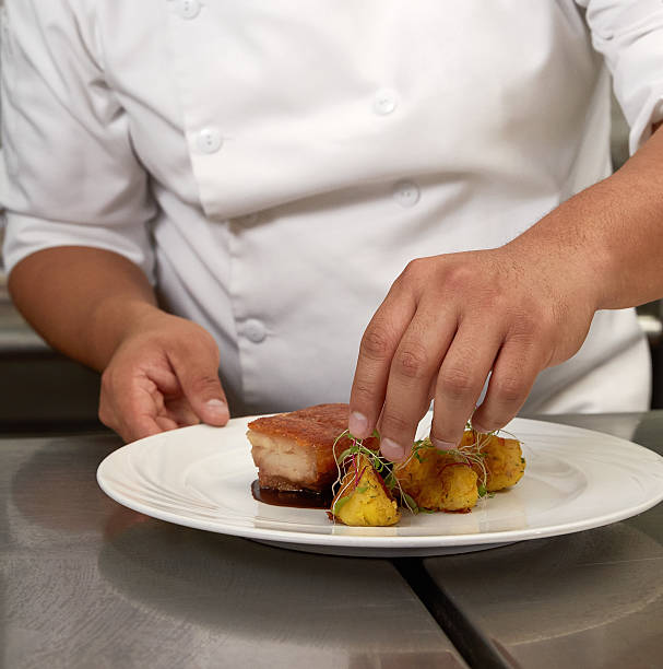 istock Chef Decorating Traditional Peruvian Meal Pork Pork Bacon Chicharron 625523884
