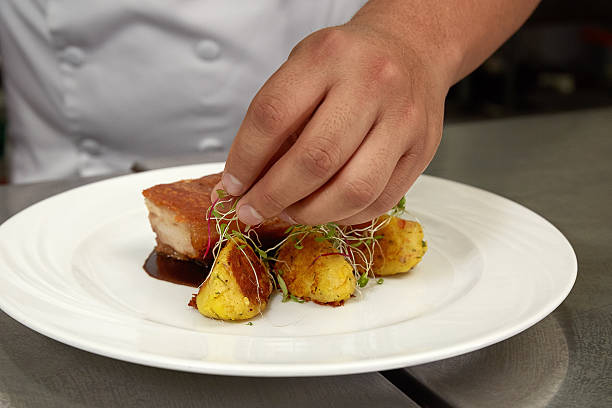 istock Chef Decorating Traditional Peruvian Meal Pork Pork Bacon Chicharron 625524352