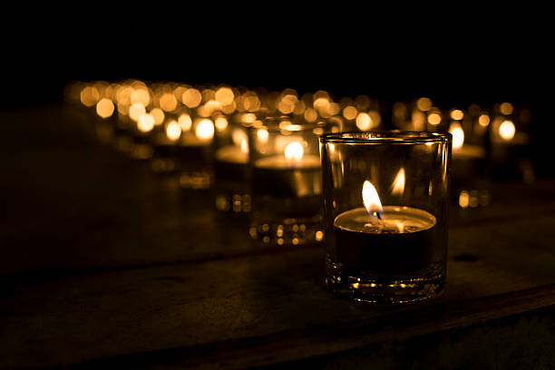 istock cup candle light in the small cup in a row 625525552