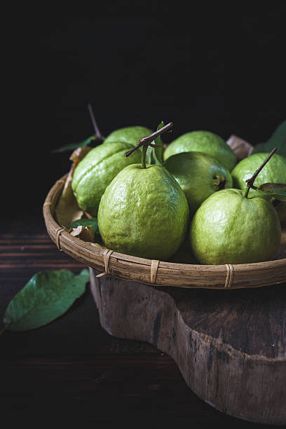 Green Guavas Green Guavas on the old wood guava photos stock pictures, royalty-free photos & images