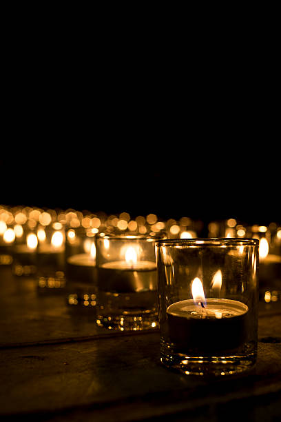 istock cup candle light in the small cup in a row 625527548