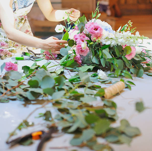 istock Hands of florist woman creating bouquets 625527880