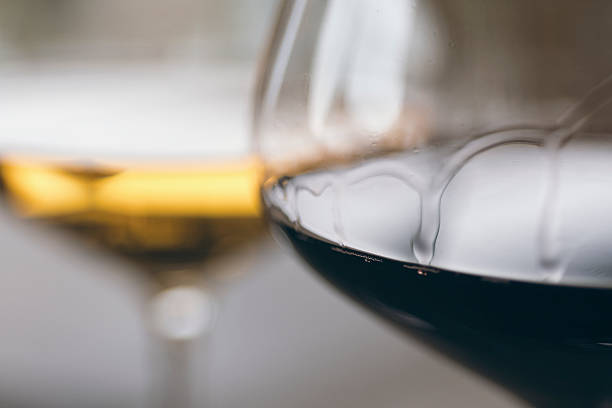 istock Glasses of Red and White Wine Close Up 625528448