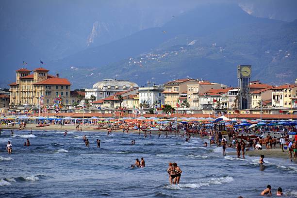 Viareggio, Italy - August 17, 2016: People on the beach at Viareggio, Versilia's riviera, a popular summer resort in Tuscany.