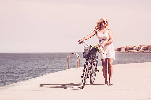 istock Mature woman riding bicycle 625549432