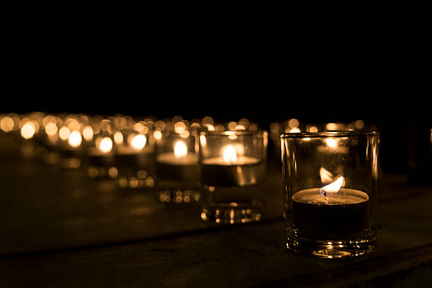 istock cup candle light in the small cup in a row 625551134