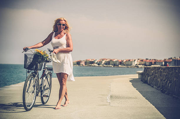 istock Mature woman riding bicycle 625585404