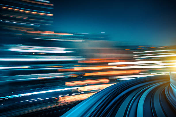 Long exposure shot from a moving train abstract motion-blurred view from the front of a train in Tokio, Japan tokyo bullet train stock pictures, royalty-free photos & images