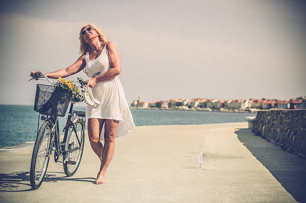 istock Mature woman riding bicycle 625586972