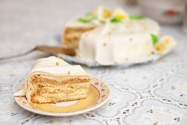 istock Piece of white mastic cake decorated with flowers, closeup 625593474