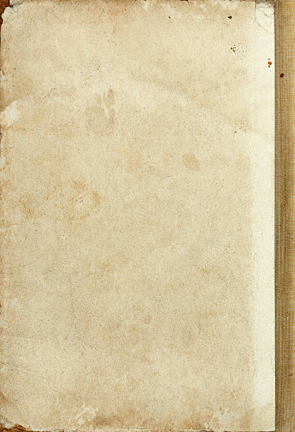 istock Cardboard old book cover texture with textile part 625596230