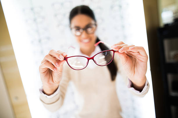 istock Woman selecting eyeglasses in optical store 625596742