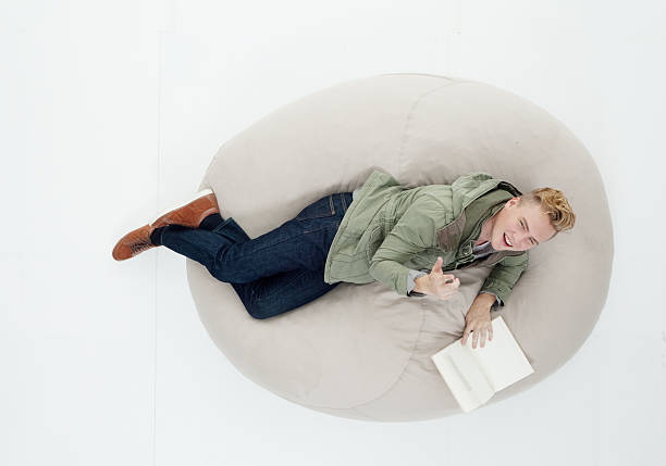 istock Above view of man lying on bean bag 625596938