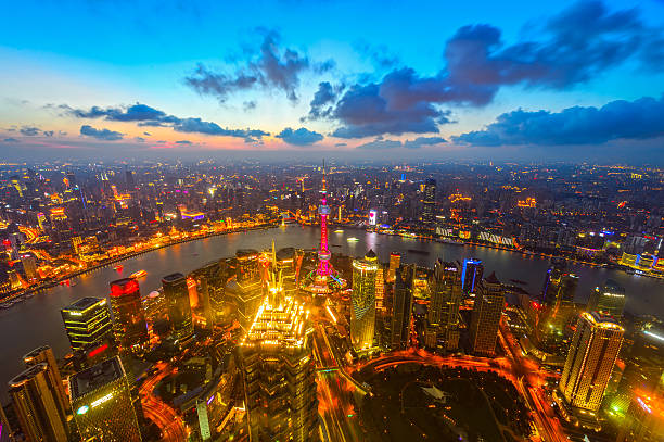 istock Modern cityscape and illuminated skyline at dawn 625599716